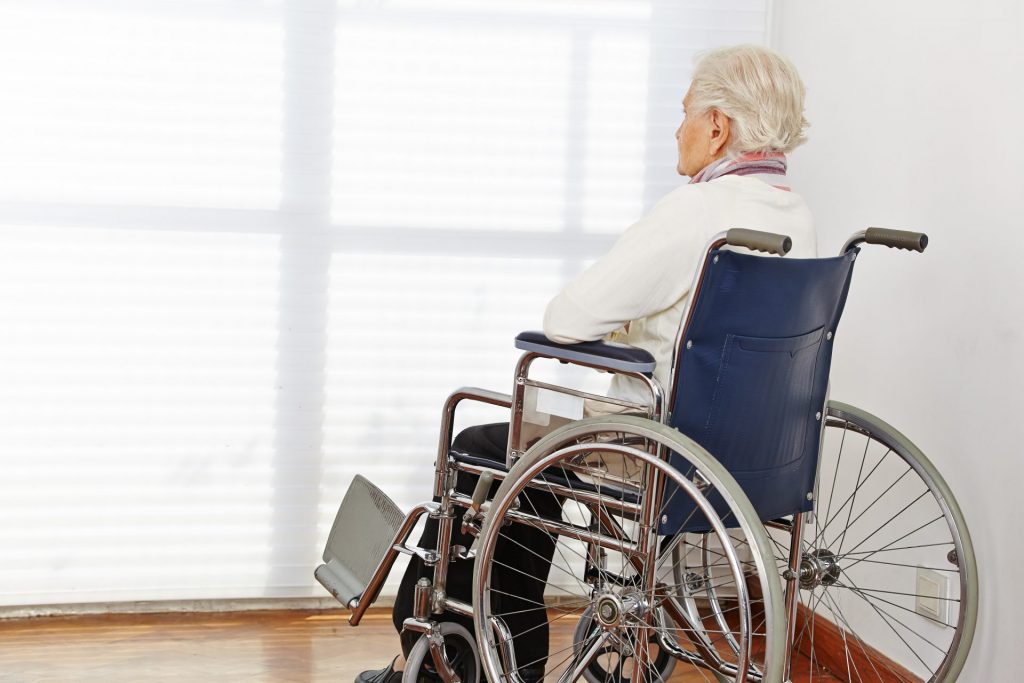 Man in Wheelchair in Nursing Home