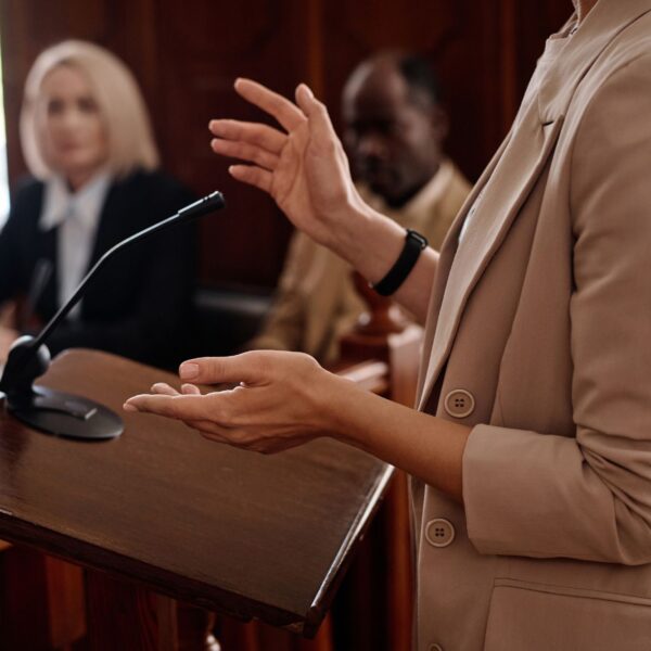 A person giving a speech in a courtroom.
